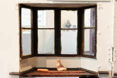 By Window with Knife and Bread Board